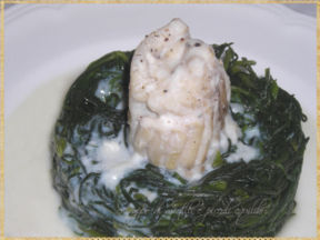 Rotolo di merluzzo su nido di agretti