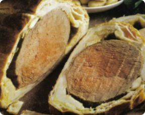 Carrè di maiale con mele e pancetta.